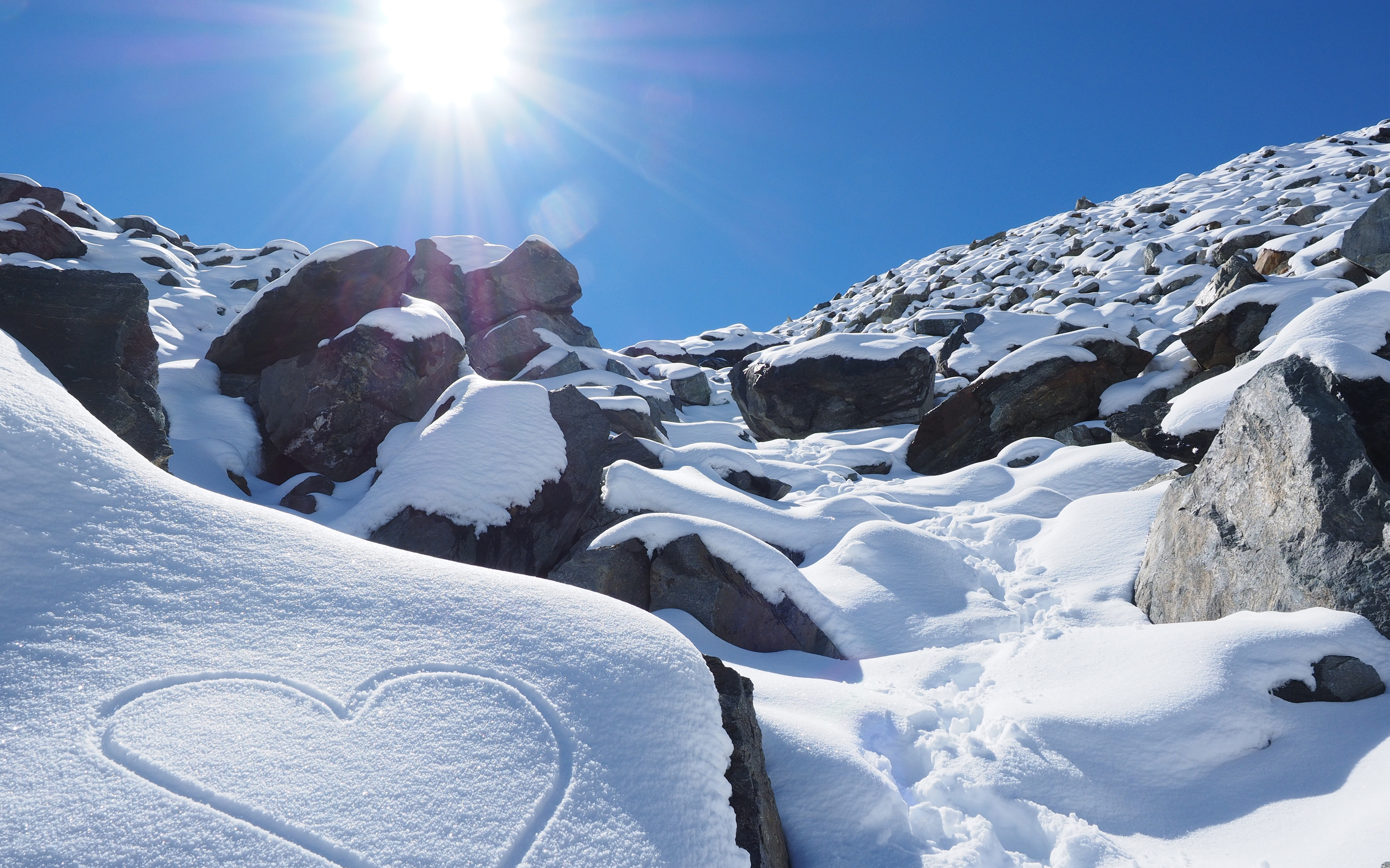 sunny_snow_rocks_4k-wide.jpg